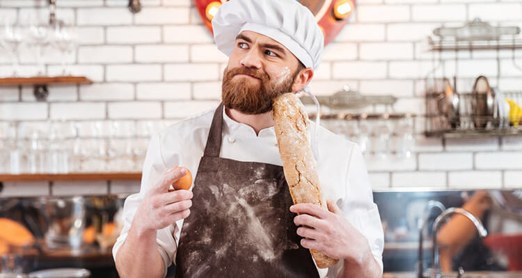 Chef holding a freshly baked loaf